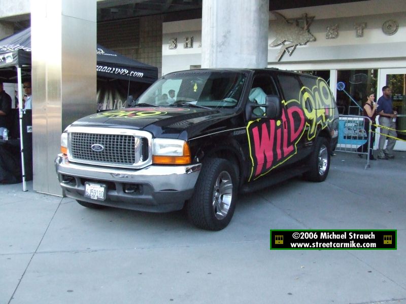 A Wild 94.9 Ford SUV parked at